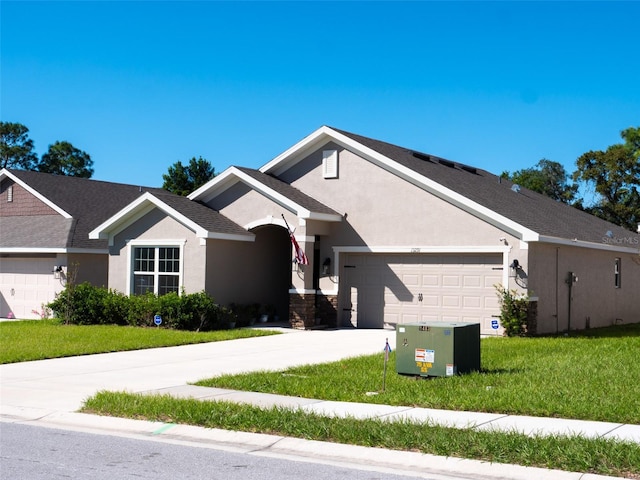 view of front facade with a front yard and a garage