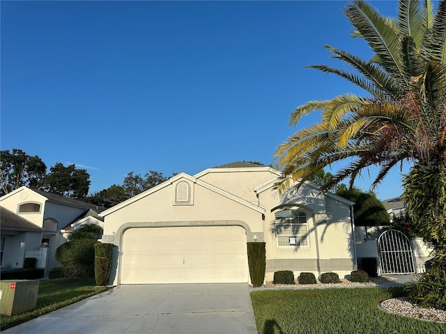 view of front of house with a front yard and a garage