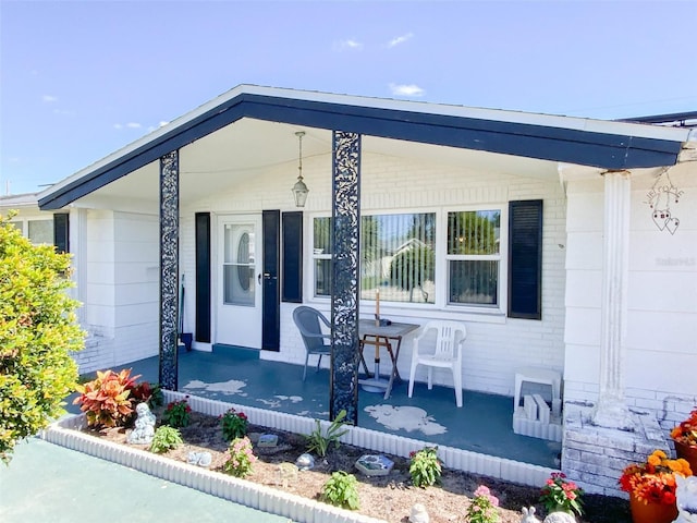 entrance to property featuring a porch