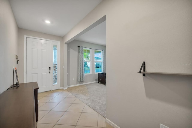 foyer entrance with light tile patterned flooring