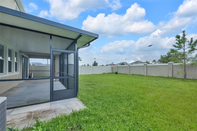 view of yard with a sunroom