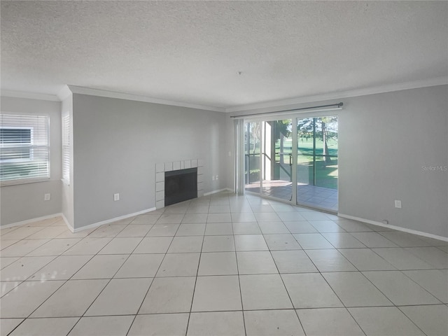 unfurnished living room featuring crown molding, a textured ceiling, light tile patterned floors, and a fireplace