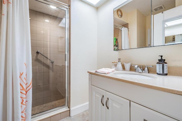 bathroom featuring vanity, tile patterned floors, and a shower with shower curtain