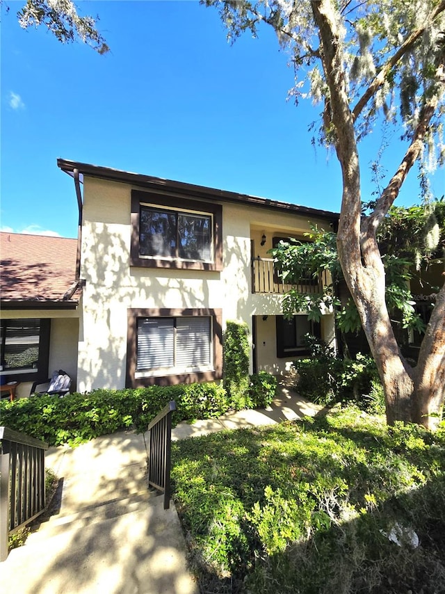 view of front of house with a balcony