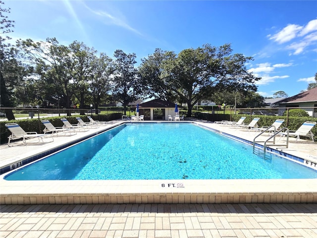 view of swimming pool featuring a patio