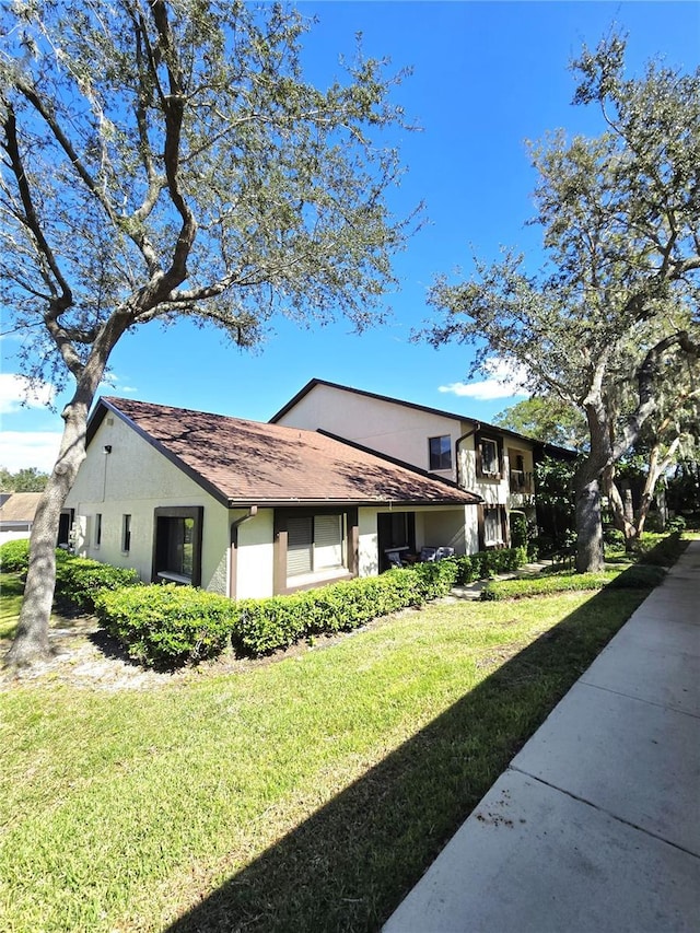 view of home's exterior featuring a lawn