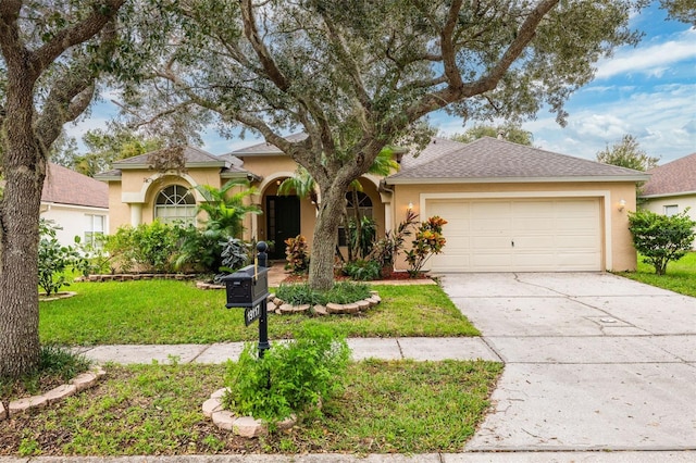 view of front facade with a front yard and a garage