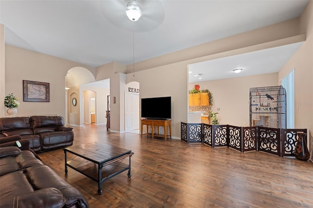 living room with ceiling fan and hardwood / wood-style flooring