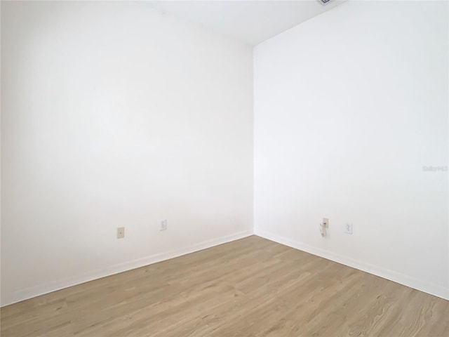 spare room featuring light hardwood / wood-style floors