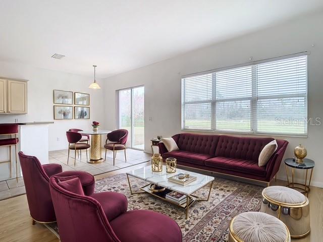 living room with light hardwood / wood-style flooring