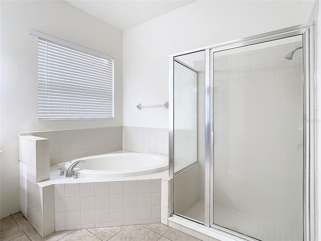 bathroom with tile patterned floors and plus walk in shower