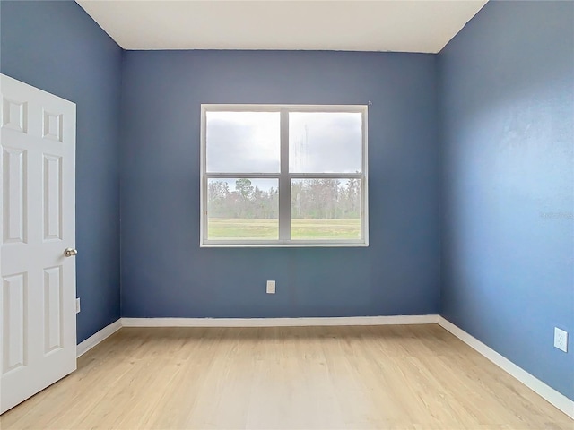 unfurnished room featuring light hardwood / wood-style floors