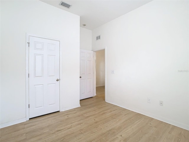 unfurnished bedroom with light wood-type flooring