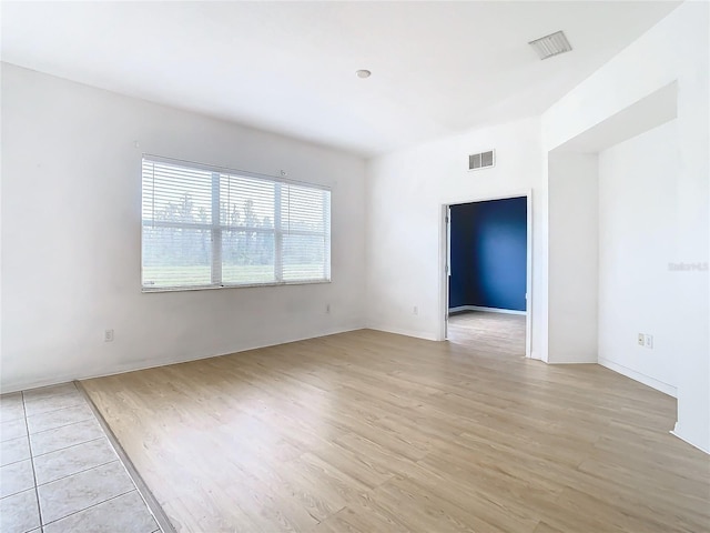 unfurnished room featuring light wood-type flooring