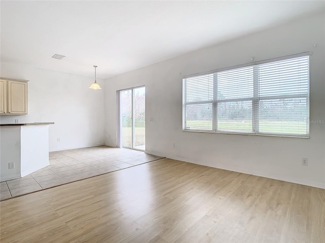 unfurnished living room featuring light hardwood / wood-style floors