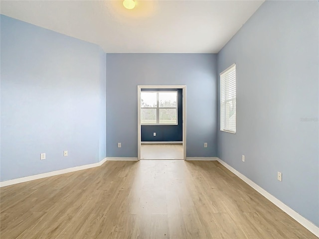 unfurnished room with light hardwood / wood-style floors