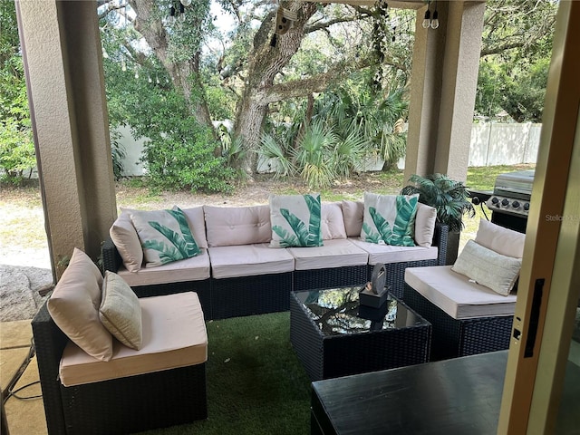 view of patio featuring an outdoor hangout area and a grill