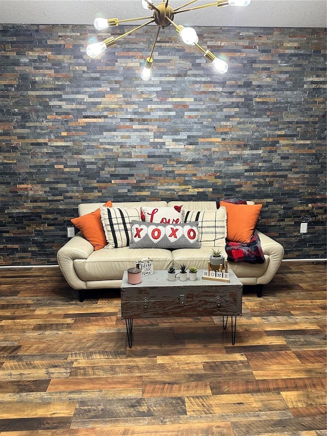 living room with dark wood-type flooring and a textured ceiling