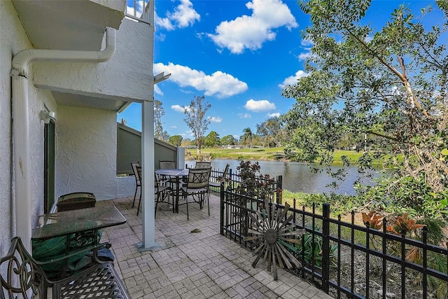 view of patio / terrace with a water view