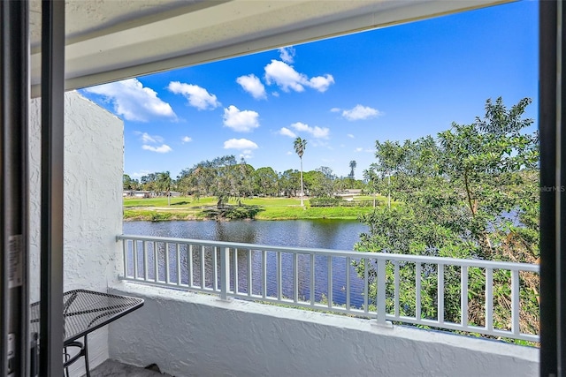 balcony featuring a water view