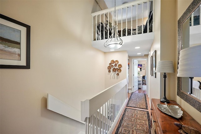 hallway featuring a high ceiling and hardwood / wood-style floors