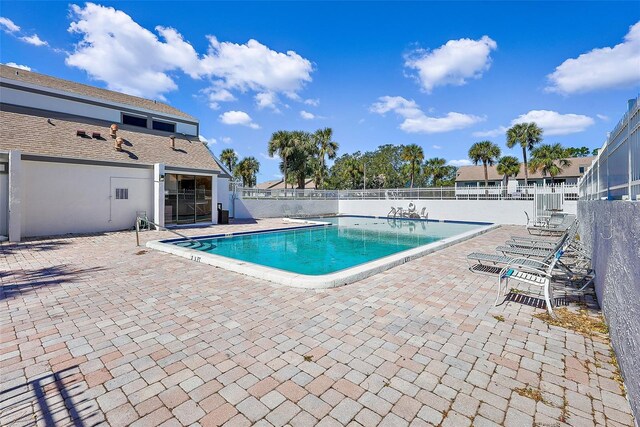 view of swimming pool featuring a patio