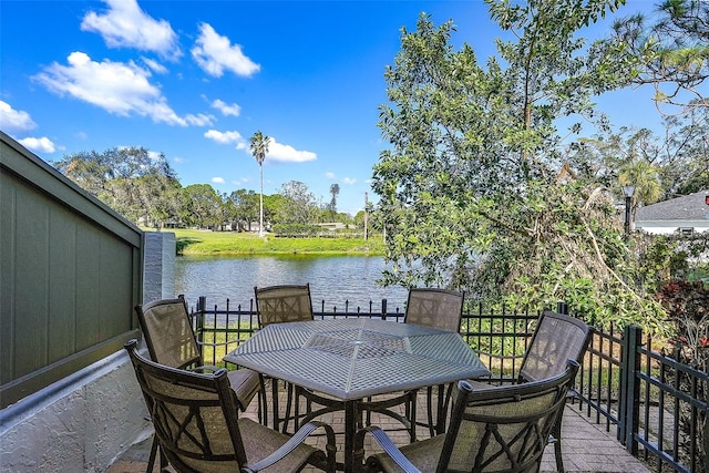 wooden deck featuring a water view