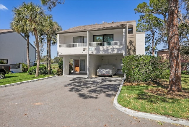 view of front of home with a balcony