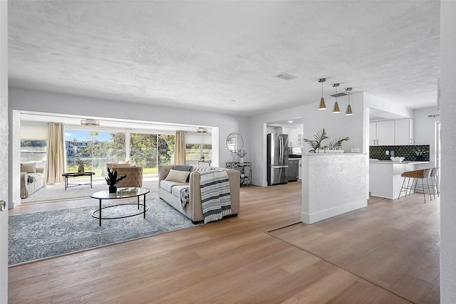 living room featuring light wood-type flooring