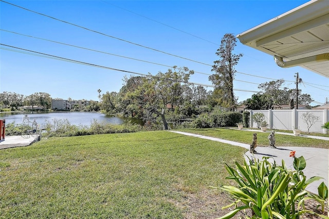 view of yard featuring a water view and a patio area