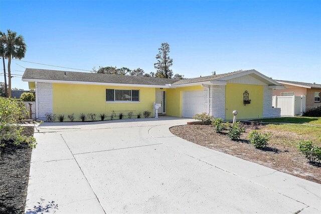 ranch-style home featuring a garage