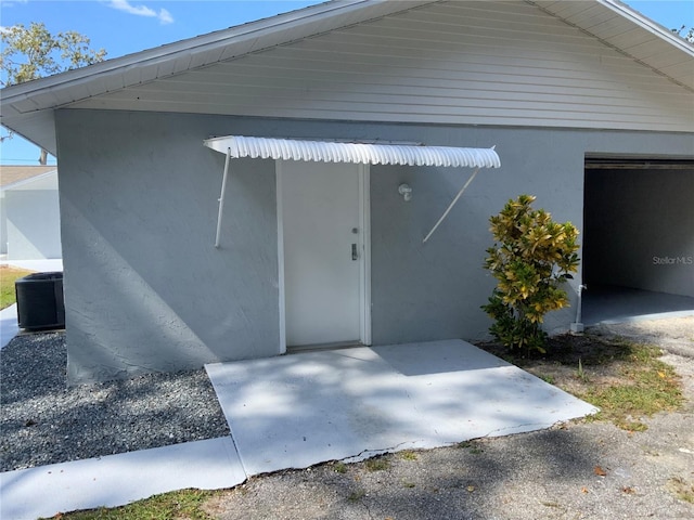 exterior space featuring central AC unit