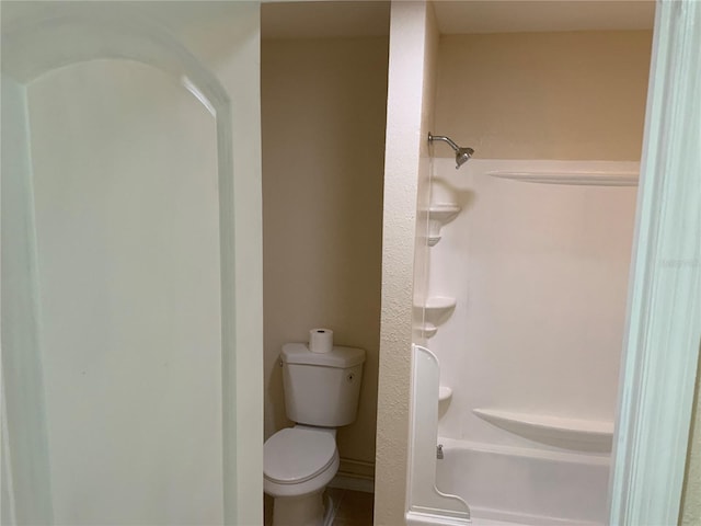 bathroom with toilet and shower / washtub combination