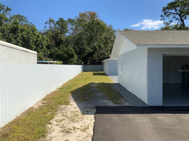 view of yard with a garage