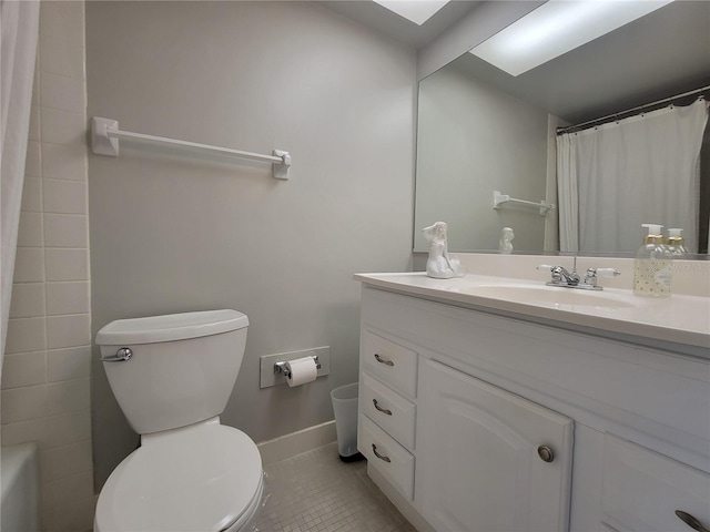 bathroom with vanity, toilet, and tile patterned flooring