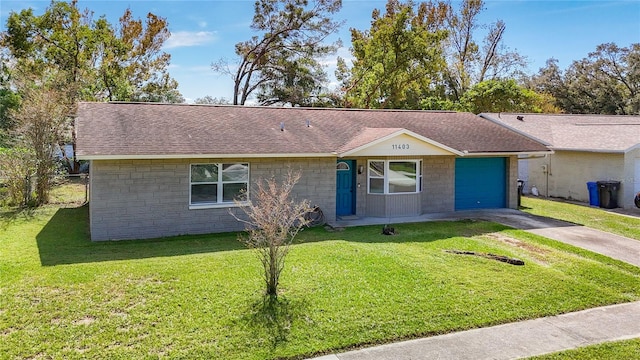 single story home featuring a front yard and a garage