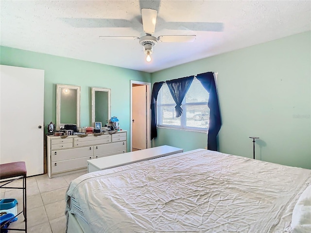 bedroom featuring ceiling fan and light tile patterned floors