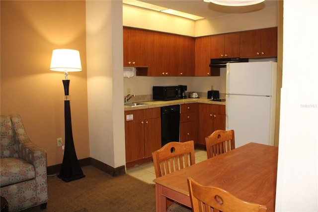 kitchen featuring sink and black appliances