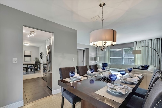 dining room featuring a chandelier