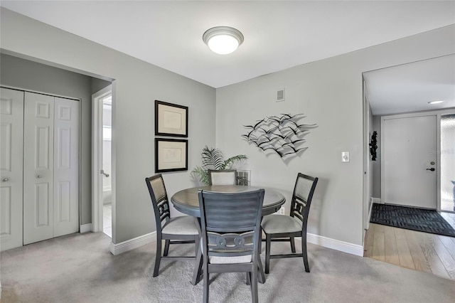 view of carpeted dining space