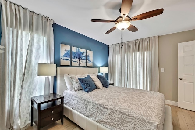 bedroom featuring ceiling fan and light hardwood / wood-style floors