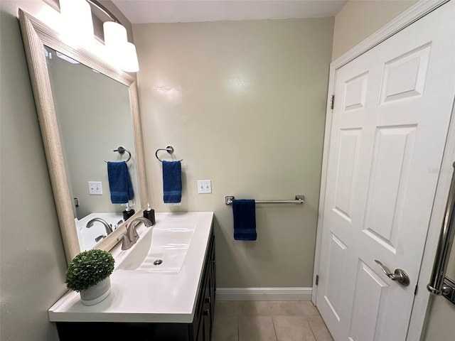 bathroom featuring tile patterned flooring and vanity