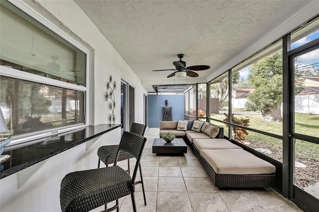 sunroom / solarium with ceiling fan