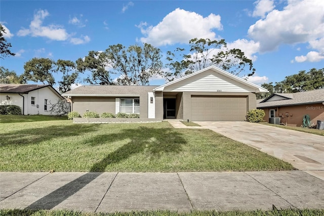 ranch-style home with cooling unit, a front yard, and a garage