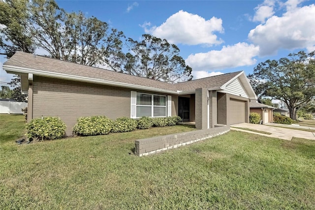 single story home with a front yard and a garage