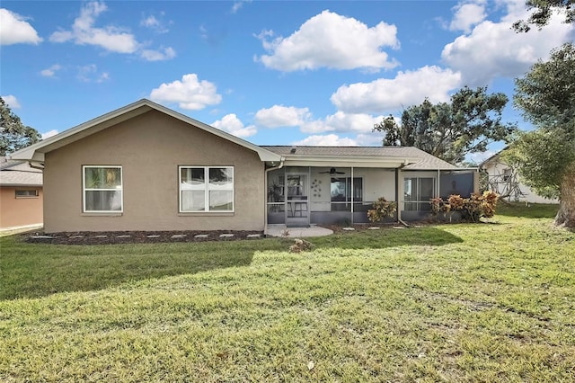 view of front of property with a sunroom and a front yard