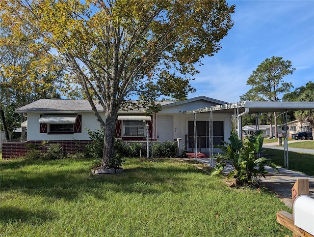 view of front of property with a carport and a front yard