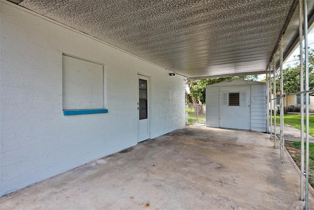 view of patio / terrace featuring a storage shed