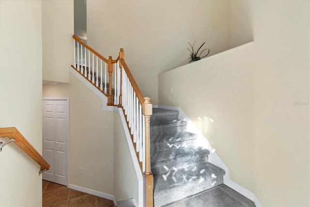 staircase with tile patterned flooring