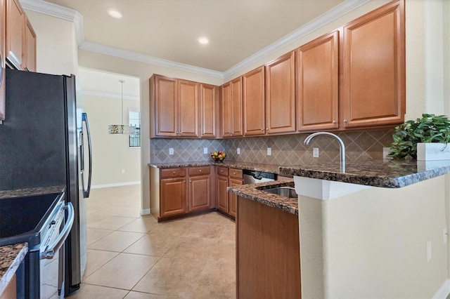 kitchen with decorative backsplash, dark stone counters, stainless steel appliances, and crown molding